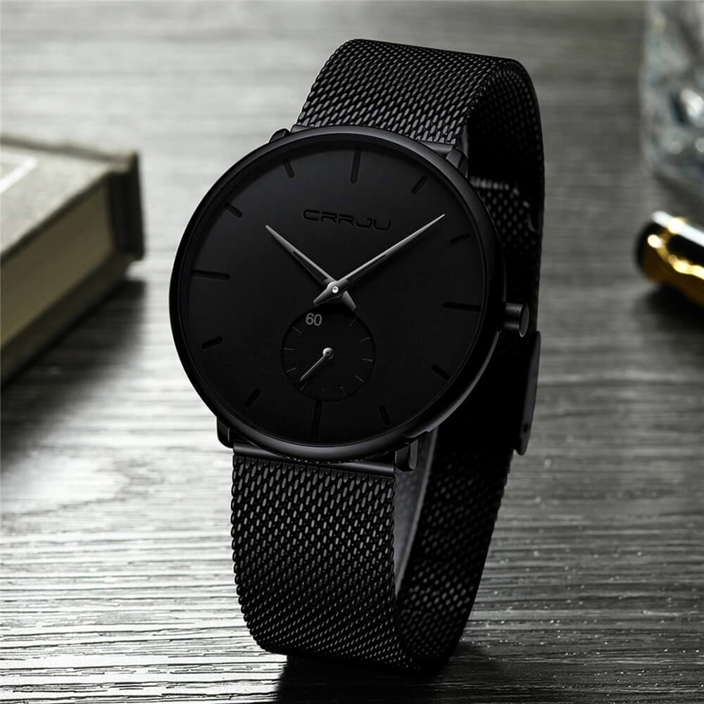 Montre analogique en acier inoxydable noire - Design moderne et minimaliste.