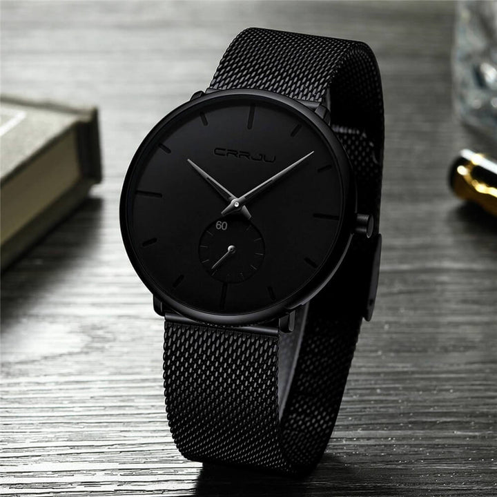 Montre analogique en acier inoxydable noire - Design moderne et minimaliste.