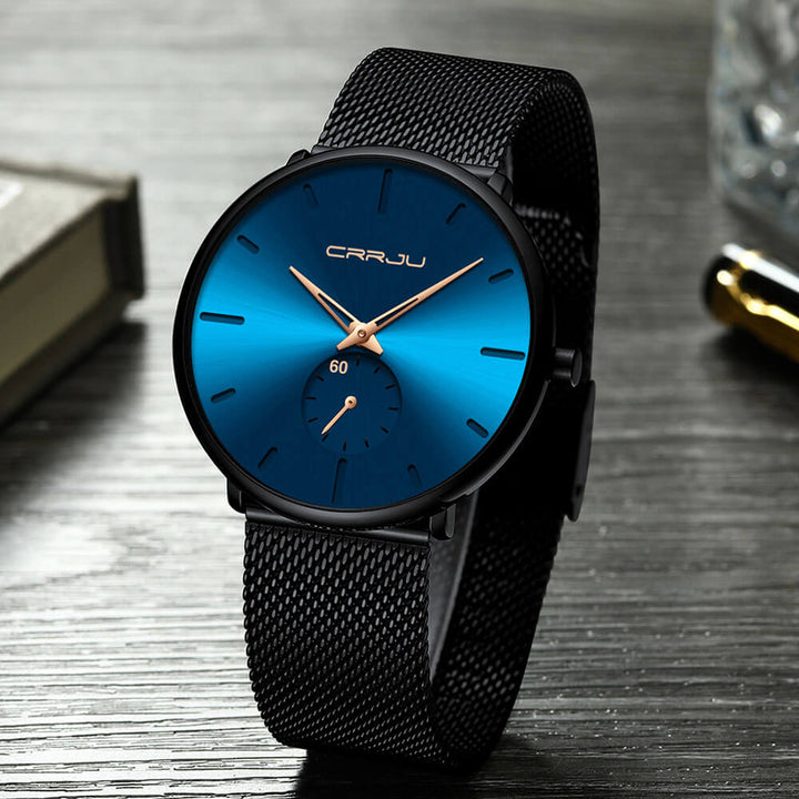 Montre analogique en acier inoxydable noire - Design moderne et minimaliste.