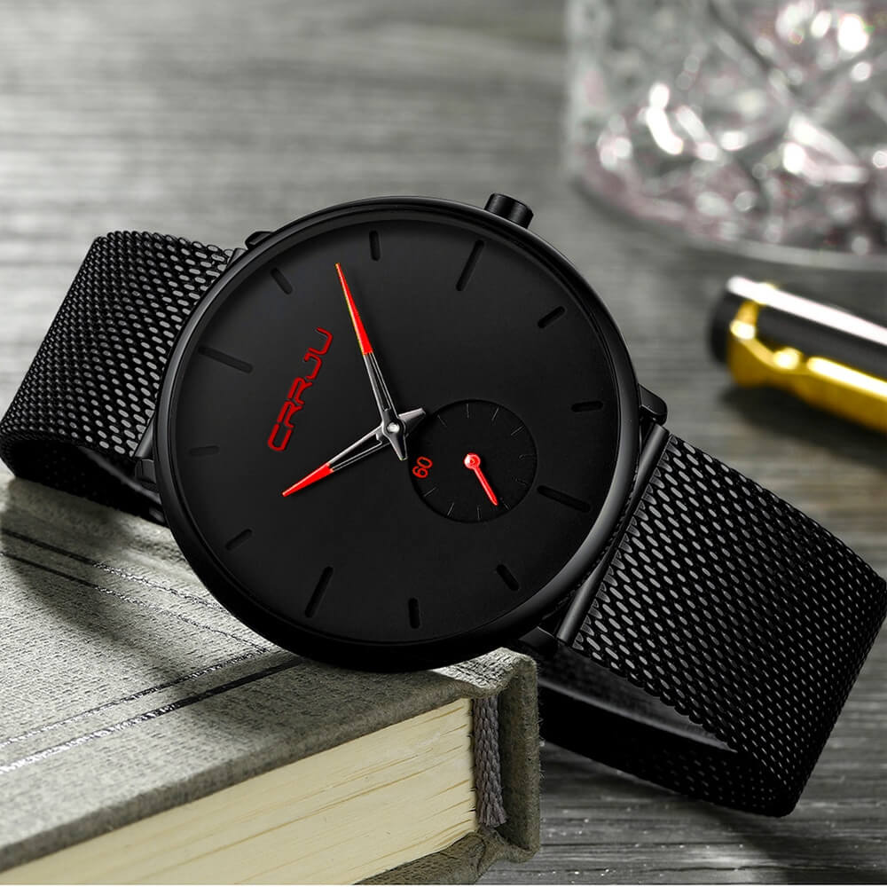 Montre analogique en acier inoxydable noire - Design moderne et minimaliste.