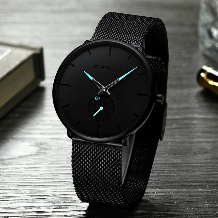 Montre analogique en acier inoxydable noire - Design moderne et minimaliste.