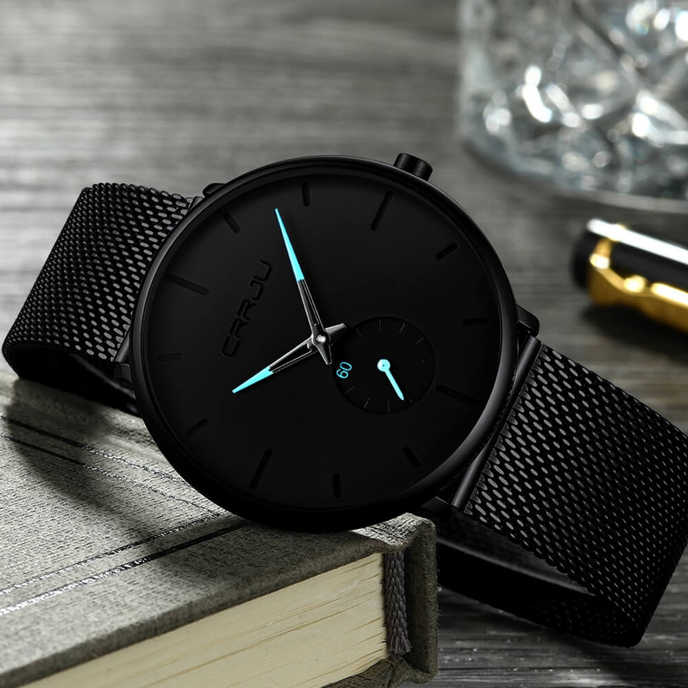 Montre analogique en acier inoxydable noire - Design moderne et minimaliste.