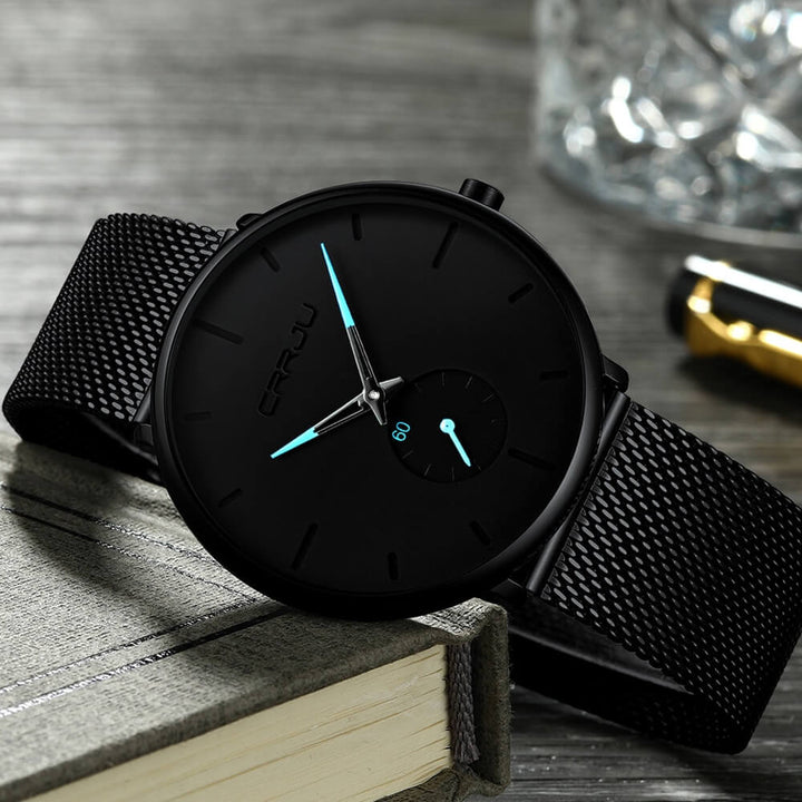 Montre analogique en acier inoxydable noire - Design moderne et minimaliste.