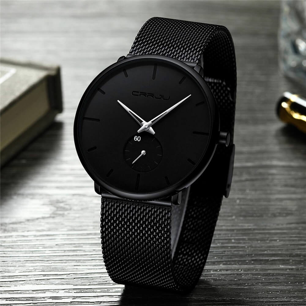Montre analogique en acier inoxydable noire - Design moderne et minimaliste.