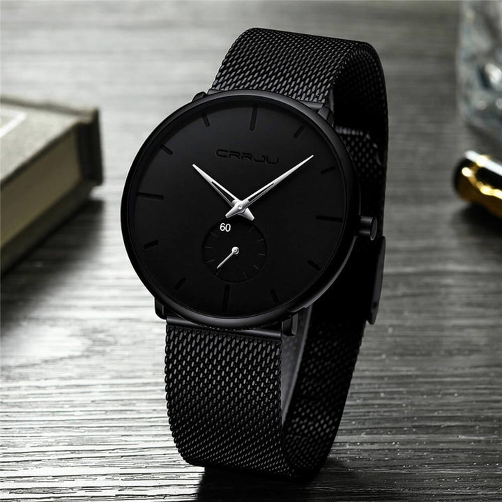 Montre analogique en acier inoxydable noire - Design moderne et minimaliste.