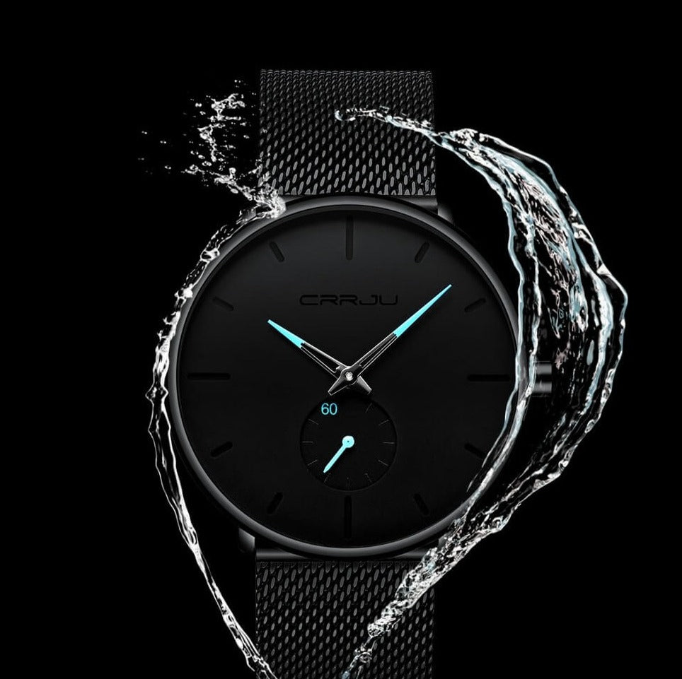Montre analogique en acier inoxydable noire - Design moderne et minimaliste.