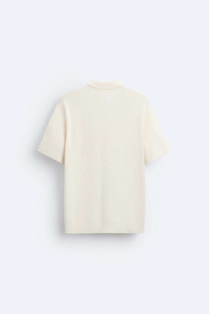 Polo tricotée élégante avec fermeture éclair pour un look raffiné