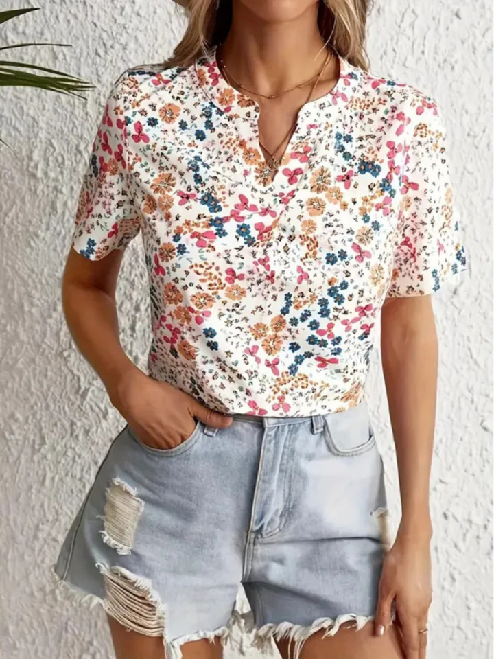 Chemisier pour femmes Lucrezia avec motif floral élégant à manches courtes - Le haut parfait pour toute occasion.
