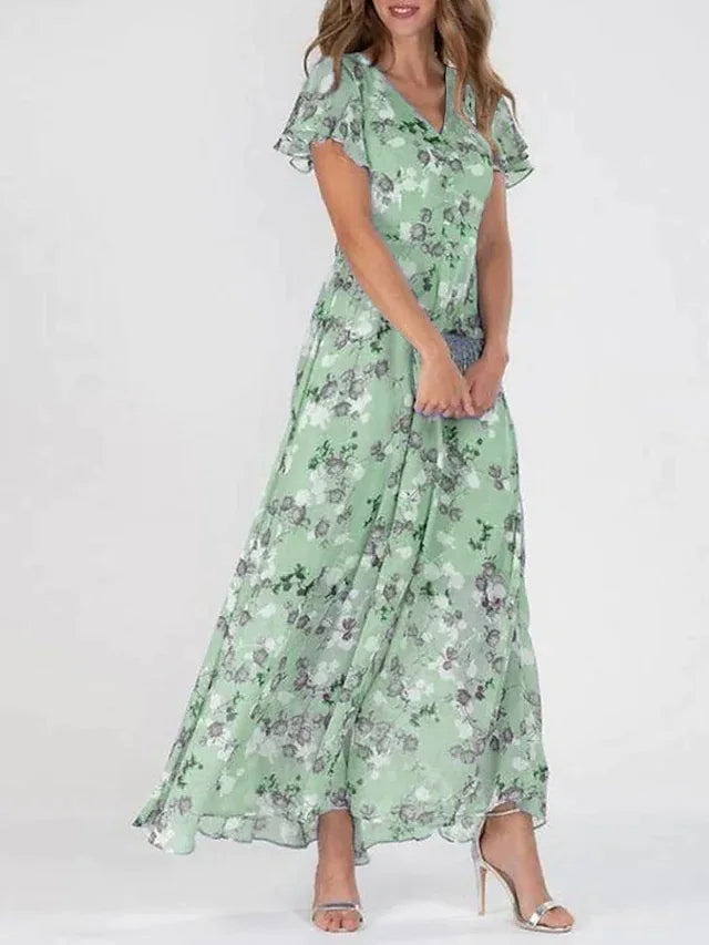 Euthalia | Robe maxi florale luxueuse avec des tissus fluides et un élégant col en V pour femmes.