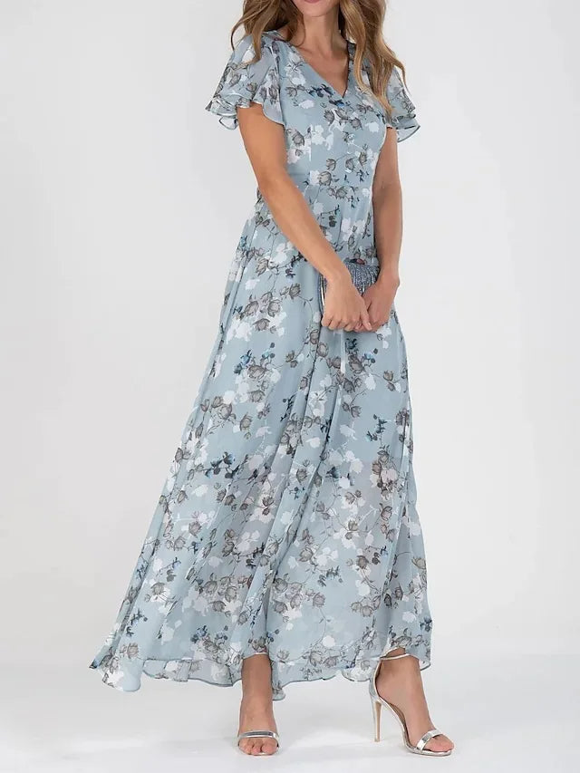 Euthalia | Robe maxi florale luxueuse avec des tissus fluides et un élégant col en V pour femmes.