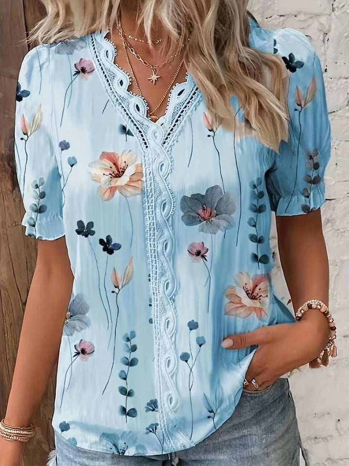Jonida | Elégant chemisier à fleurs pour dames avec col en V et détails en dentelle - Top décontracté confortable à manches courtes