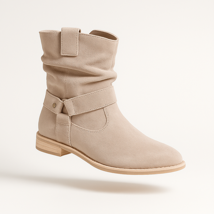 Bottines en suede élégantes avec un talon bas chic et une fermeture éclair pratique.