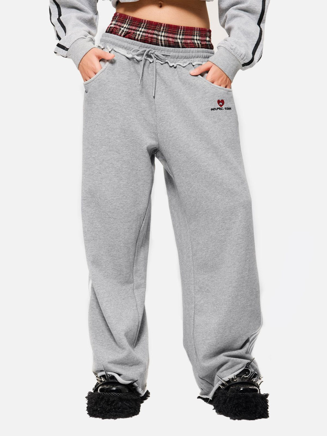 Jazzlyn - Pantalon de jogging grise chic avec une luxueuse ceinture double pour confort et style.