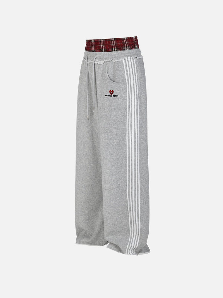 Jazzlyn - Pantalon de jogging grise chic avec une luxueuse ceinture double pour confort et style.