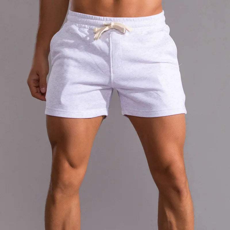 Shorts décontractés pour hommes avec taille élastique, en coton respirant et ajustement réglable avec poches latérales.