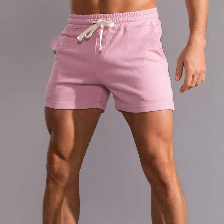 Shorts décontractés pour hommes avec taille élastique, en coton respirant et ajustement réglable avec poches latérales.
