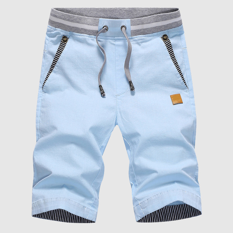 Shorts décontractés élégants pour hommes avec taille à cordon, poches zippées pratiques et coupe confortable arrivant au genou.