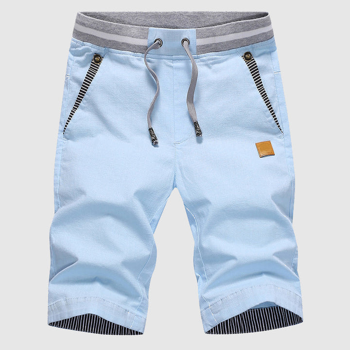 Shorts décontractés élégants pour hommes avec taille à cordon, poches zippées pratiques et coupe confortable arrivant au genou.