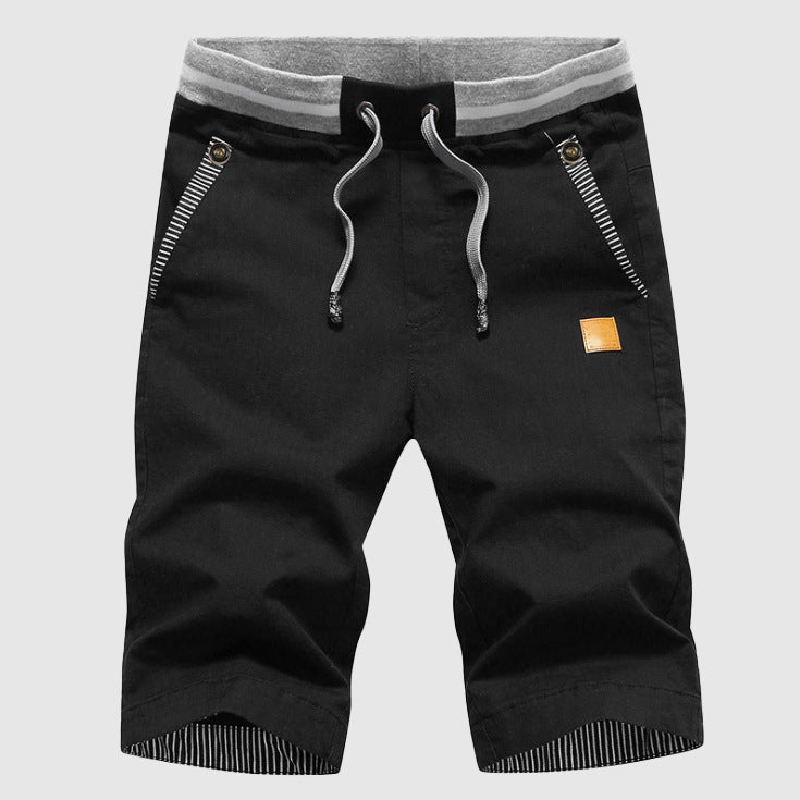 Shorts décontractés élégants pour hommes avec taille à cordon, poches zippées pratiques et coupe confortable arrivant au genou.