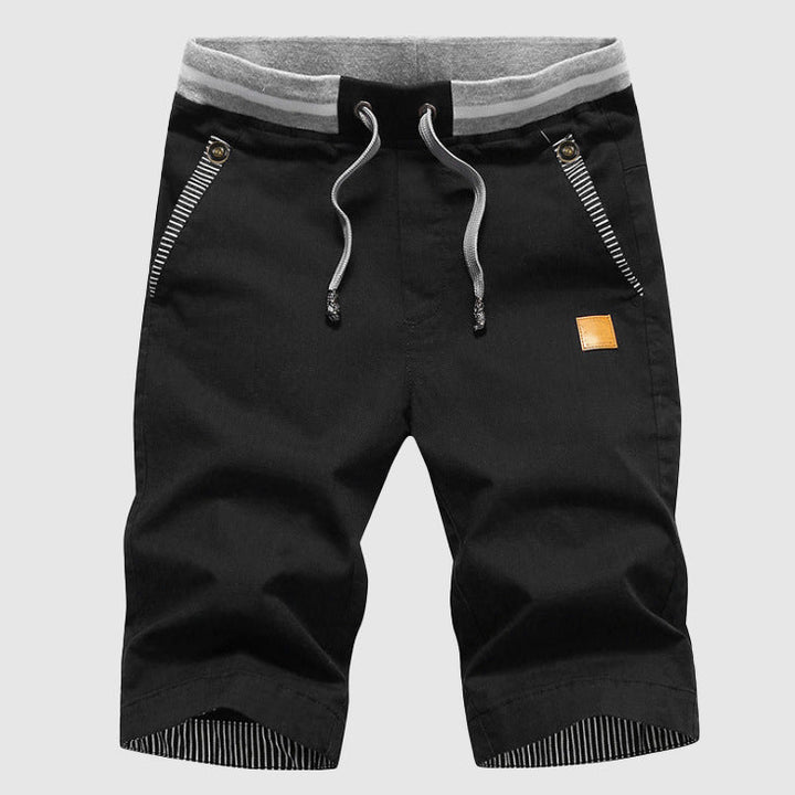 Shorts décontractés élégants pour hommes avec taille à cordon, poches zippées pratiques et coupe confortable arrivant au genou.