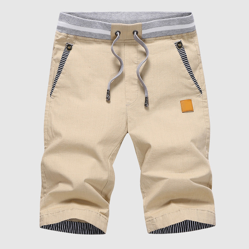 Shorts décontractés élégants pour hommes avec taille à cordon, poches zippées pratiques et coupe confortable arrivant au genou.