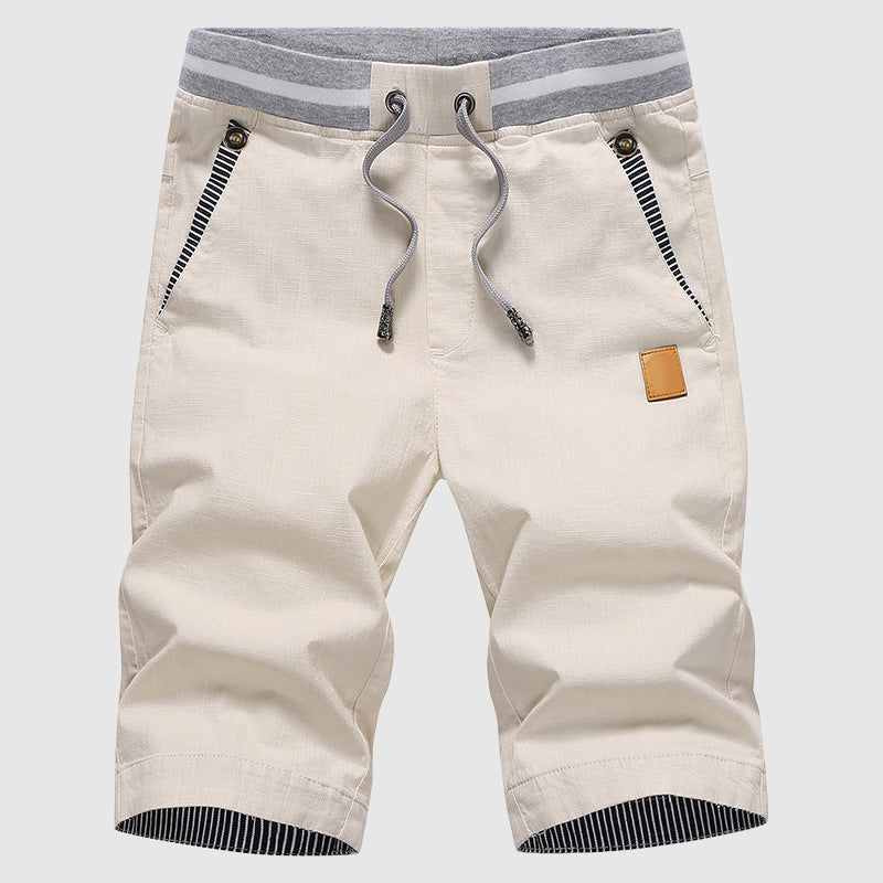 Shorts décontractés élégants pour hommes avec taille à cordon, poches zippées pratiques et coupe confortable arrivant au genou.