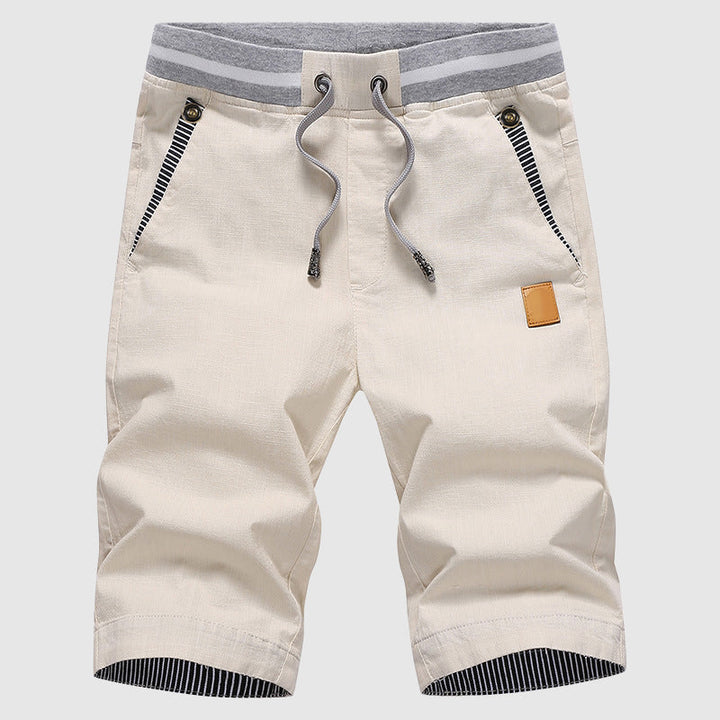 Shorts décontractés élégants pour hommes avec taille à cordon, poches zippées pratiques et coupe confortable arrivant au genou.
