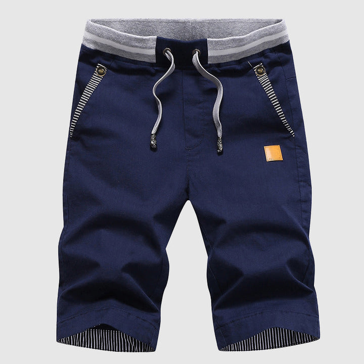 Shorts décontractés élégants pour hommes avec taille à cordon, poches zippées pratiques et coupe confortable arrivant au genou.