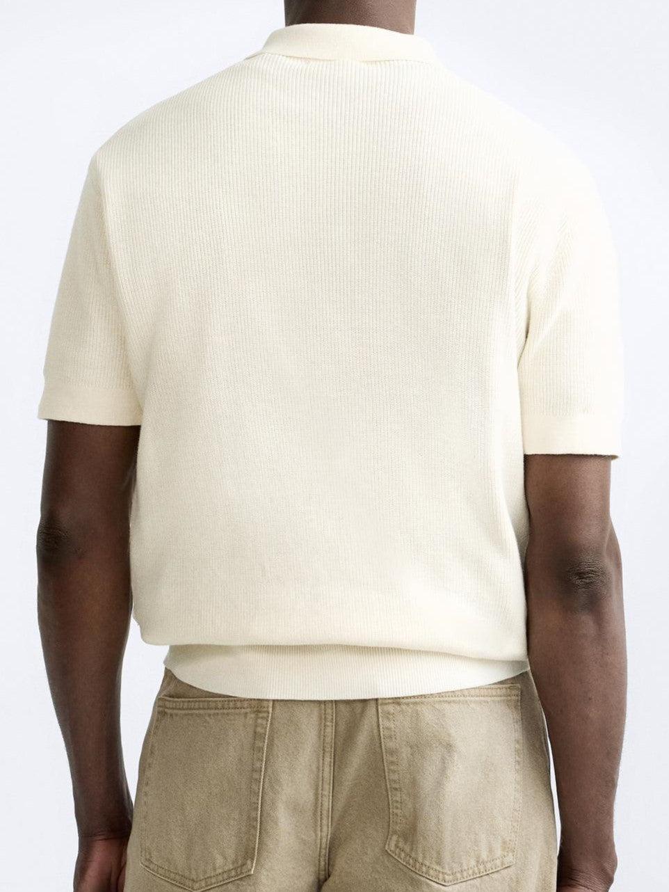 Polo tricotée élégante avec fermeture éclair pour un look raffiné