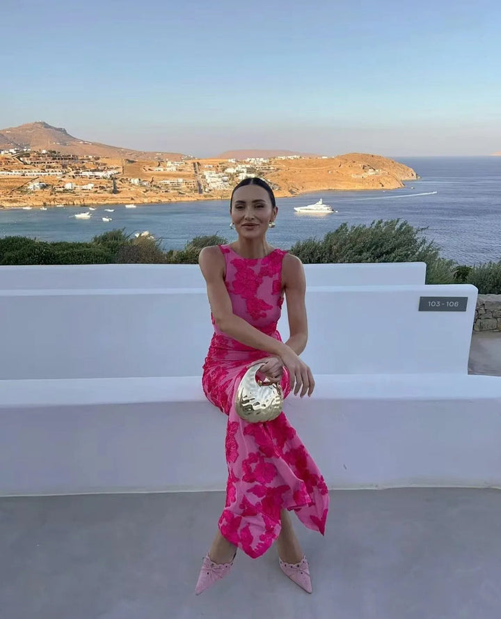 Nabila Élégante robe de chambre sans manches avec imprimé floral pour un look d'été chic et stylé.