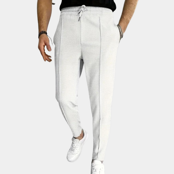 Pantalon de survêtement pour homme Mitchel avec cordon de serrage pour un confort optimal.