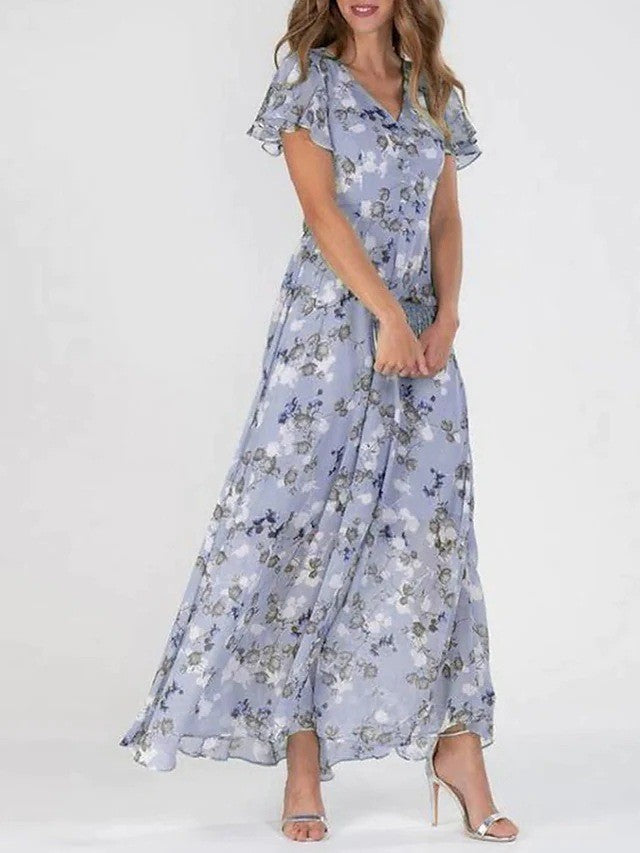 Euthalia | Robe maxi florale luxueuse avec des tissus fluides et un élégant col en V pour femmes.