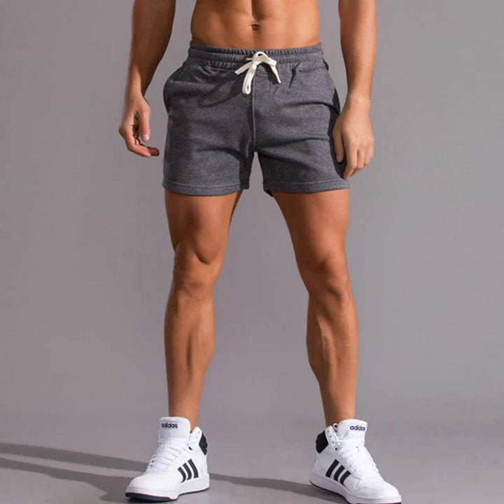 Shorts décontractés pour hommes avec taille élastique, en coton respirant et ajustement réglable avec poches latérales.
