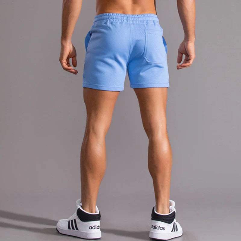 Shorts décontractés pour hommes avec taille élastique, en coton respirant et ajustement réglable avec poches latérales.