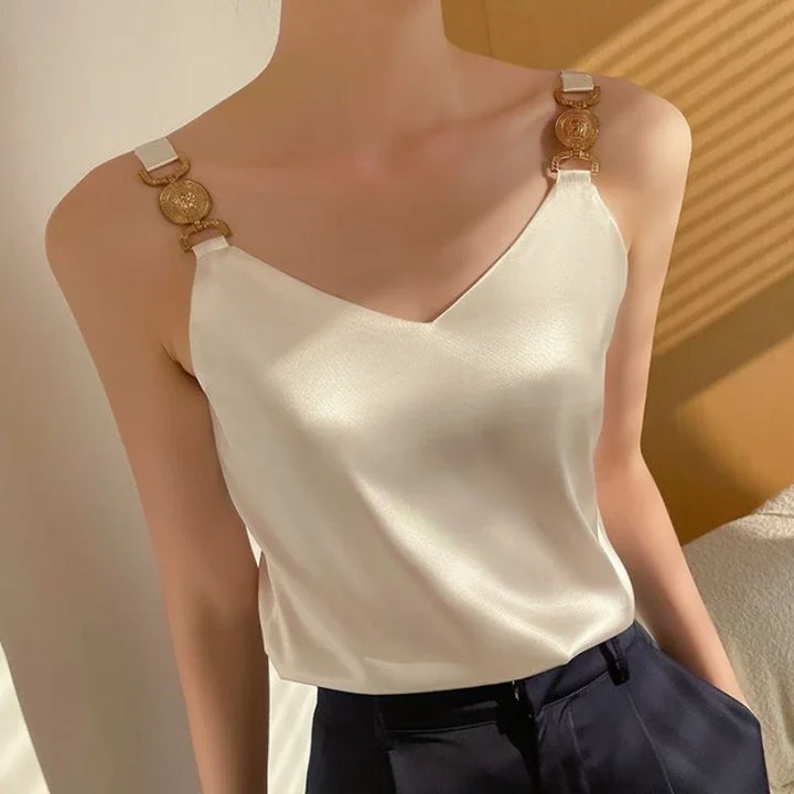 Claire - Haut élégante pour dames avec décolleté en V et détails de épaules dorés saisissants