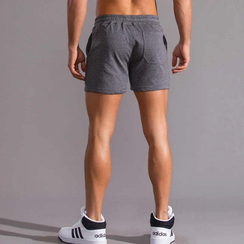 Shorts décontractés pour hommes avec taille élastique, en coton respirant et ajustement réglable avec poches latérales.
