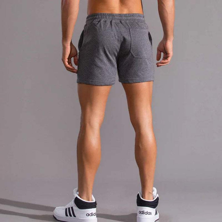 Shorts décontractés pour hommes avec taille élastique, en coton respirant et ajustement réglable avec poches latérales.