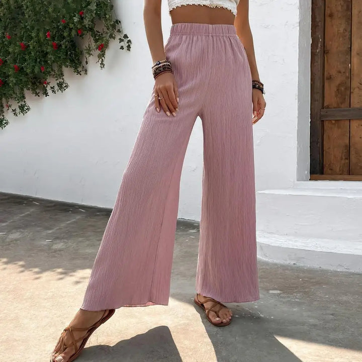 Pantalon d'été léger et confortable pour femmes, avec des jambes larges pour un look élégant et décontracté.