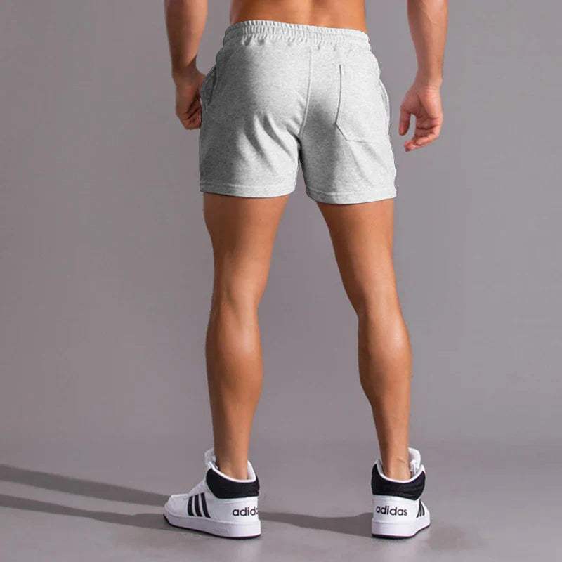 Shorts décontractés pour hommes avec taille élastique, en coton respirant et ajustement réglable avec poches latérales.