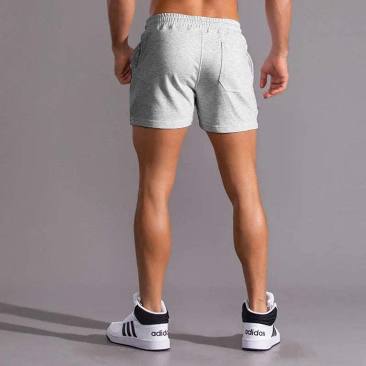 Shorts décontractés pour hommes avec taille élastique, en coton respirant et ajustement réglable avec poches latérales.