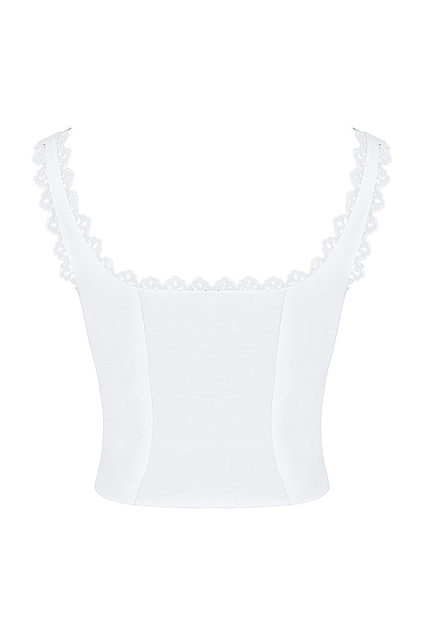 Top court en dentelle blanche chic avec un nœud élégant et une mini-jupe A-ligne en lin stylée.