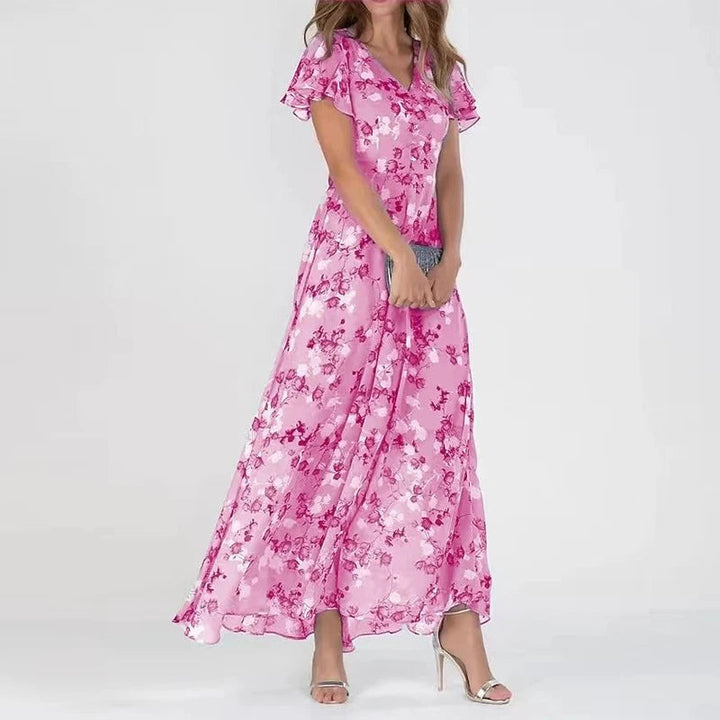 Euthalia | Robe maxi florale luxueuse avec des tissus fluides et un élégant col en V pour femmes.