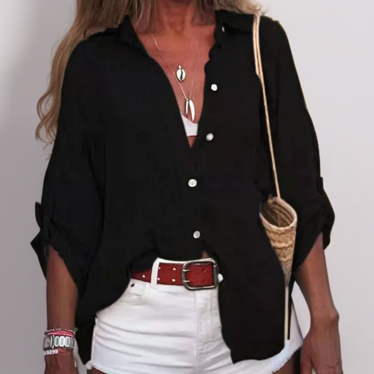 Linda - Charmante blouse en lin en léger, avec des manches roulées élégantes.