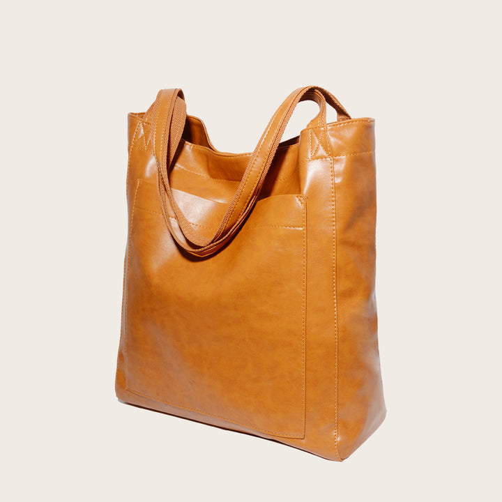 Nova - Élégante sac en cuir avec fermeture par bouton-pression et espace de rangement supplémentaire.